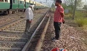 Man dies falls from running train