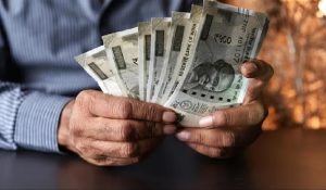 Rupee hits record low, approaches 84 amidst global market uncertainity