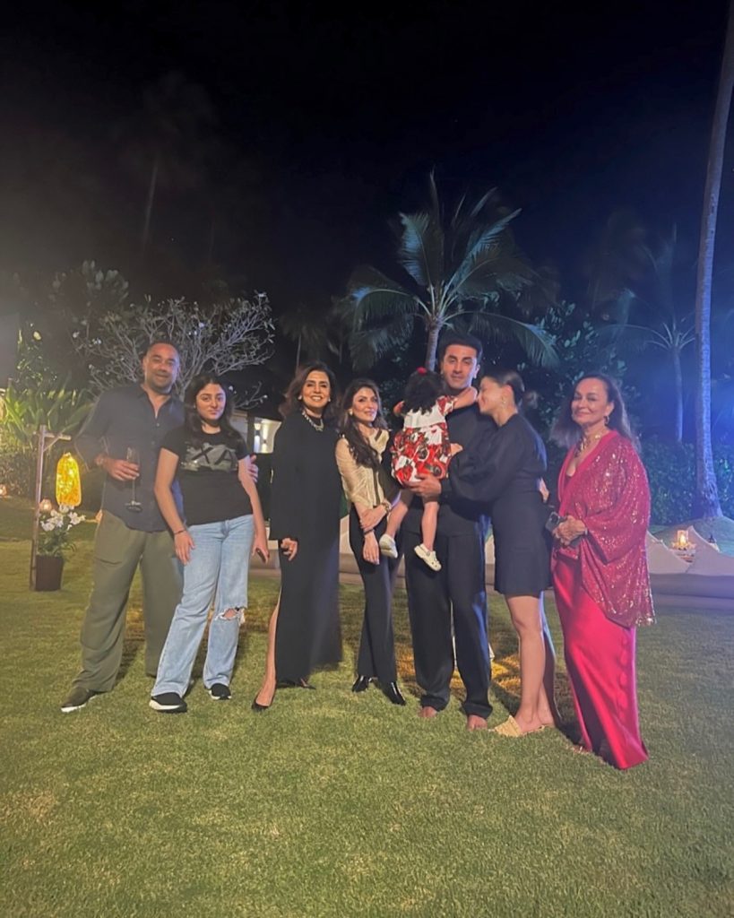 Ranbir is seen holding a glass as he joins the Kapoor family to watch fireworks light up the night sky.