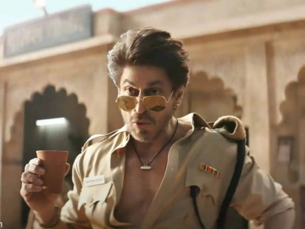 In the viral video, Shah Rukh Khan exudes effortless swag, donning the uniform of a Rajasthani cop while chasing down robbers on a motorbike.