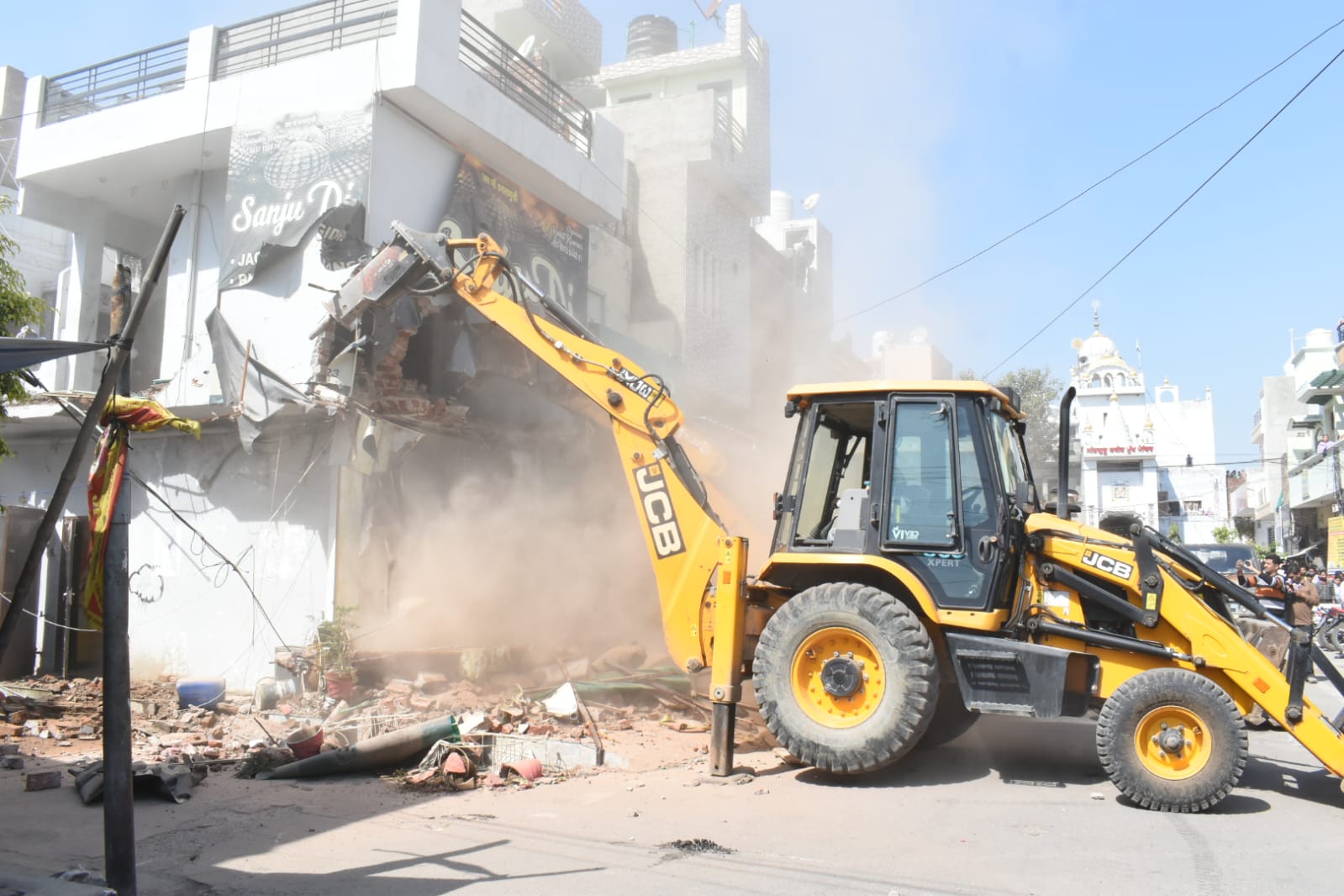 Double story house belonging to three drug smugglers demolished in Jalandhar