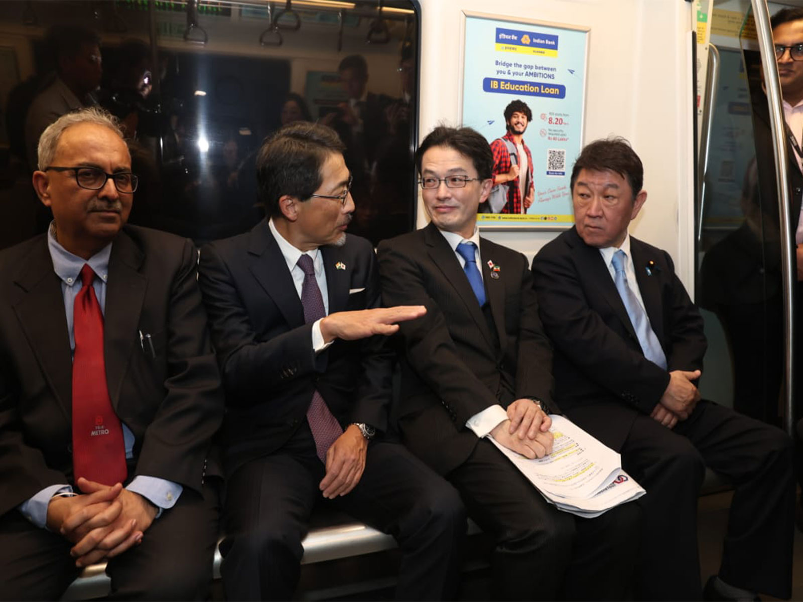Japanese Foreign Minister Toshimitsu Motegi takes a ride on Delhi Metro