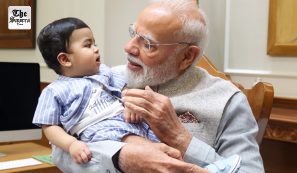 PM Modi cradles little Omy, melts hearts across social media
