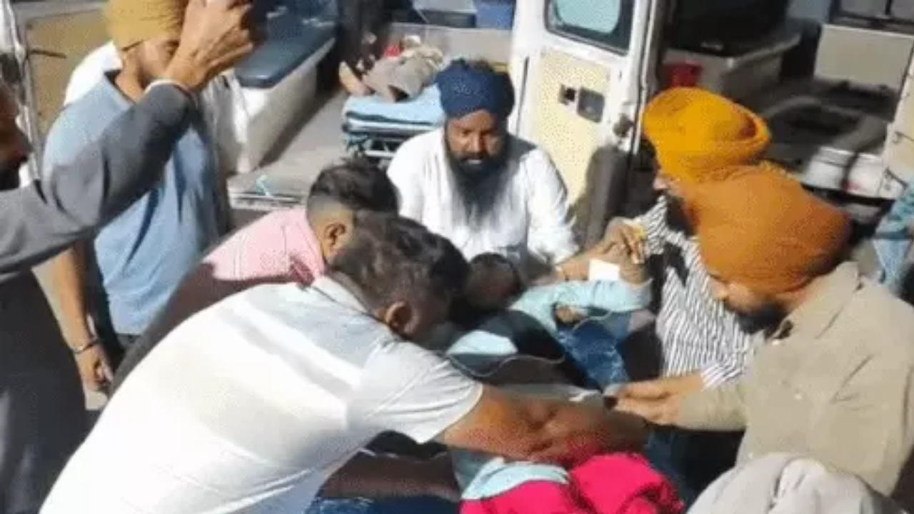 Shifting the injured woman into the ambulance during the accident.