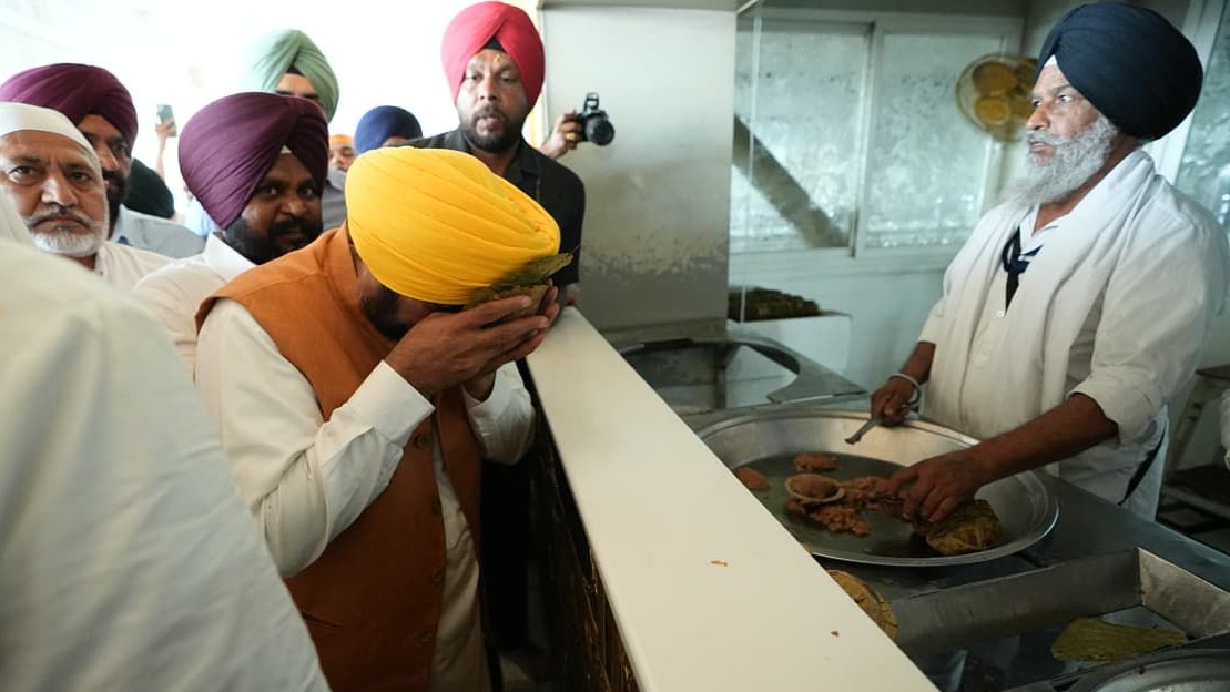 CM Bhagwant Mann after Pay obeisance at Sri Harimandir Sahib takes the Kadah Parshad