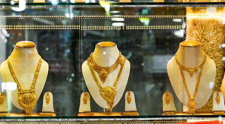Gold, silver decline up to 2 pc on hawkish Fed signals ahead of festive buying